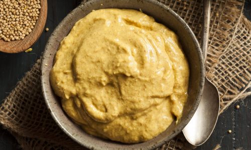 Homemade Spicy Mustard Sauce on a Background